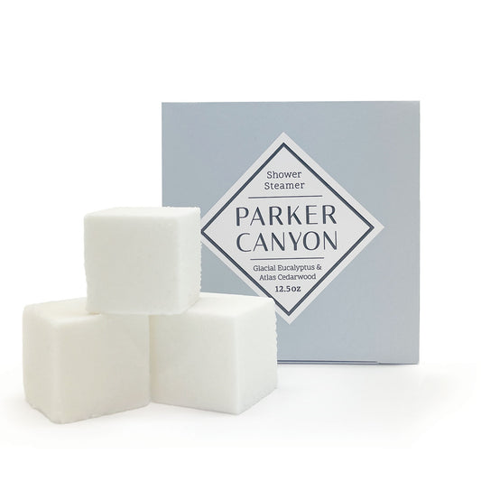 Set of shower steamers with Glacial Eucalyptus & Atlas Cedarwood packaging box on a white background