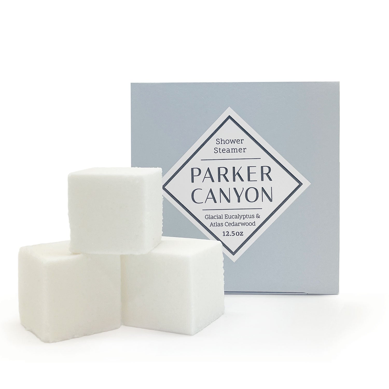 Set of shower steamers with Glacial Eucalyptus & Atlas Cedarwood packaging box on a white background